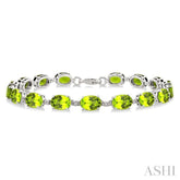 7X5 MM Oval Shape Peridot and 1/10 Ctw Single Cut Diamond Semi-Precious Bracelet in Sterling Silver