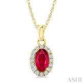 5x3 MM Oval Shape Ruby and 1/20 Ctw Round Cut Diamond Halo Precious Pendant with Chain in 10K Yellow Gold