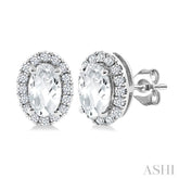 5x3 MM Oval Shape White Topaz and 1/8 Ctw Round Cut Diamond Halo Semi-Precious Stud Earrings in 10K White Gold