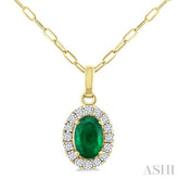 6x4 MM Oval Shape Emerald and 1/6 Ctw Round Cut Diamond Halo Precious Pendant with Chain in 14K Yellow Gold