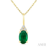 1/50 Ctw Oval Cut 6X4 MM Emerald and Round Cut Diamond Precious Pendant With Chain in 10K Yellow Gold