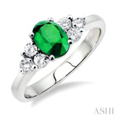 7x5mm Oval Cut Emerald and 1/3 Ctw Round Cut Diamond Ring in 14K White Gold