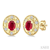 4x3 MM Oval Shaped Ruby and 1/10 Ctw Round Cut Diamond Earrings in 14K Yellow Gold