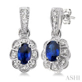 5x3 MM Oval Cut Sapphire and 1/10 Ctw Single Cut Diamond Earrings in 10K White Gold