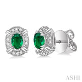 5x3 MM Oval Cut Emerald and 1/10 Ctw Single Cut Diamond Earrings in 10K White Gold