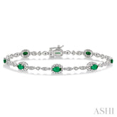 5x3 MM Oval Cut Emerald and 1/20 Ctw Round Cut Diamond Bracelet in 10K White Gold