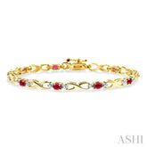 4x3 MM Oval Cut Ruby and 1/10 Ctw Single Cut Diamond Bracelet in 14K Yellow Gold