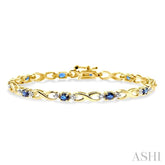 4x3 MM Oval Cut Sapphire and 1/10 Ctw Round Cut Diamond Bracelet in 14K Yellow Gold