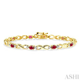 4x3 MM Oval Cut Ruby and 1/10 Ctw Round Cut Diamond Bracelet in 10K Yellow Gold