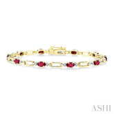 5x3 MM Oval Cut Ruby and 1/10 Ctw Round Cut Diamond Precious Bracelet in 10K Yellow Gold