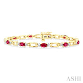 5x3 MM Oval Cut Ruby and 1/10 Ctw Round Cut Diamond Precious Bracelet in 10K Yellow Gold