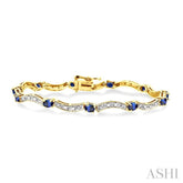 4x3 MM Oval Cut Sapphire and 1/10 Ctw Round Cut Diamond Bracelet in 14K Yellow Gold