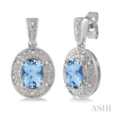 7x5 MM Oval Cut Blue Topaz and 1/20 Ctw Round Cut Diamond Earrings in Sterling Silver