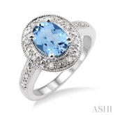 8x6 MM Oval Cut Blue Topaz and 1/20 Ctw Round Cut Diamond Ring in Sterling Silver