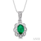 6x4 MM Oval Cut Emerald and 1/20 Ctw Round Cut Diamond Pendant in Sterling Silver with Chain