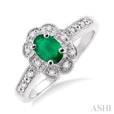 6x4 MM Oval Cut Emerald and 1/20 Ctw Round Cut Diamond Ring in Sterling Silver