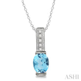 8x6 MM Oval Cut Blue Topaz and 1/50 Ctw Round Cut Diamond Pendant in Sterling Silver with Chain