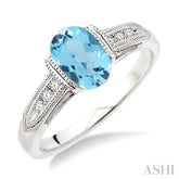 8x6 MM Oval Cut Blue Topaz and 1/20 Ctw Round Cut Diamond Ring in Sterling Silver