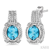 8x6 MM Oval Cut Blue Topaz and 1/20 Ctw Round Cut Diamond Earrings in Sterling Silver
