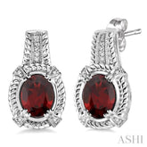 8x6 MM Oval Cut Garnet and 1/20 Ctw Round Cut Diamond Earrings in Sterling Silver