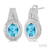 8x6 MM Oval Cut Blue Topaz a and 1/20 Ctw Round Cut Diamond Earrings in Sterling Silver