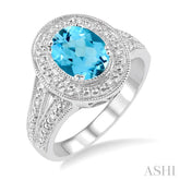 9x7 MM Oval Cut Blue Topaz a and 1/20 Ctw Round Cut Diamond Ring in Sterling Silver