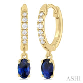 5x3 MM Oval Cut Sapphire and 1/8 Ctw Petite Round Cut Diamond Precious Fashion Huggies in 10K Yellow Gold