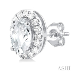 5x3 MM Oval Shape White Topaz and 1/8 Ctw Single Cut Diamond Halo Semi-Precious Stud Earrings in 14K White Gold