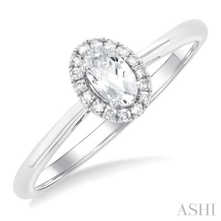 5x3 MM Oval Shape White Topaz and 1/20 Ctw Single Cut Diamond Halo Semi-Precious Ring in 10K White Gold