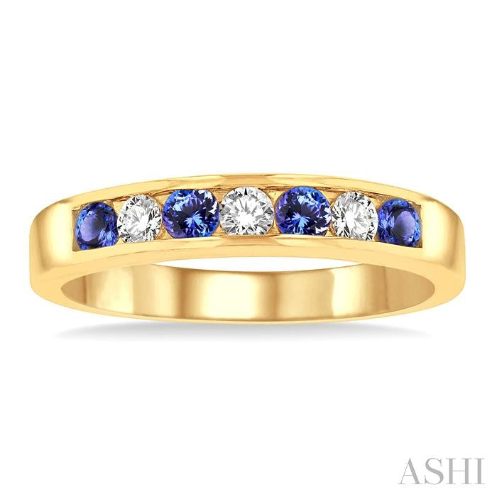 2.5 MM Round Cut Tanzanite and 1/5 Ctw Channel Set Round Cut Diamond Band in 14K Yellow Gold