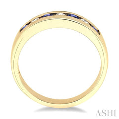 2.5 MM Round Cut Tanzanite and 1/5 Ctw Channel Set Round Cut Diamond Band in 14K Yellow Gold