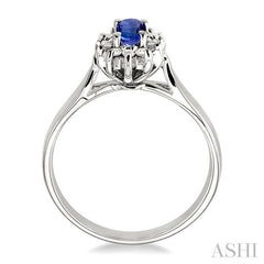 5x3mm Oval Cut Tanzanite and 1/10 Ctw Round Cut Diamond Ring in 14K White Gold