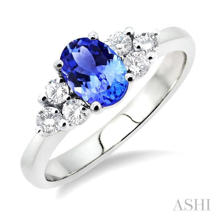 7x5mm Oval Cut Tanzanite and 1/3 Ctw Round Cut Diamond Ring in 14K White Gold