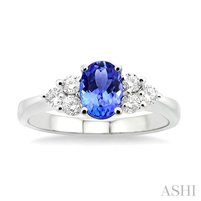 7x5mm Oval Cut Tanzanite and 1/3 Ctw Round Cut Diamond Ring in 14K White Gold