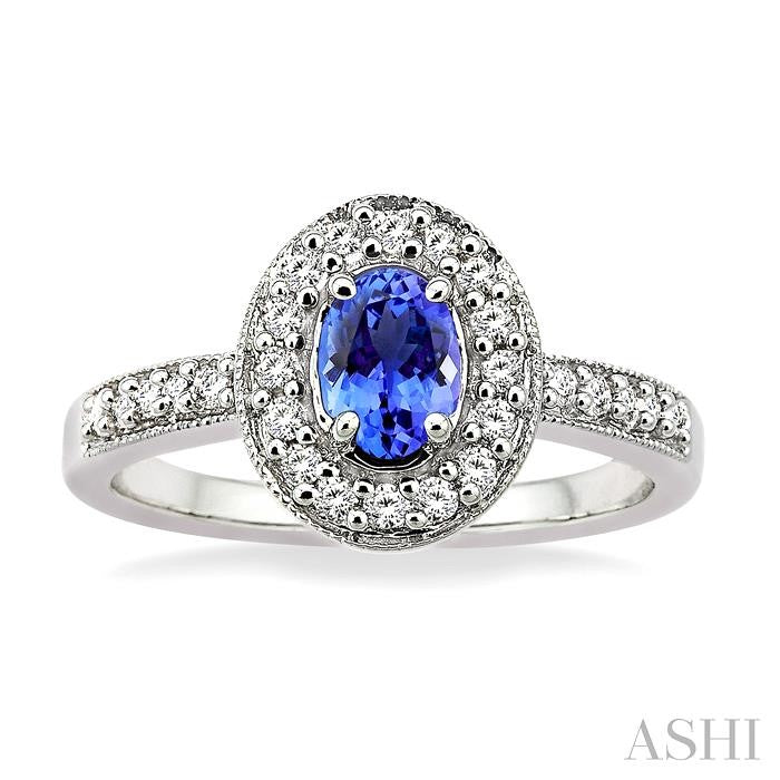 6x4mm Oval Cut Tanzanite and 1/4 Ctw Round Cut Diamond Ring in 14K White Gold