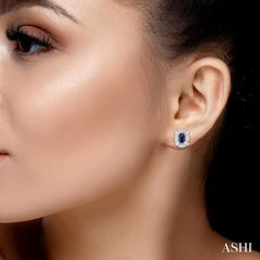 5x3 MM Oval Cut Sapphire and 1/10 Ctw Round Cut Diamond Earrings in 10K White Gold