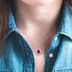 6x4 MM Oval Cut Ruby and 1/10 Ctw Round Cut Diamond Pendant in 10K White Gold with Chain