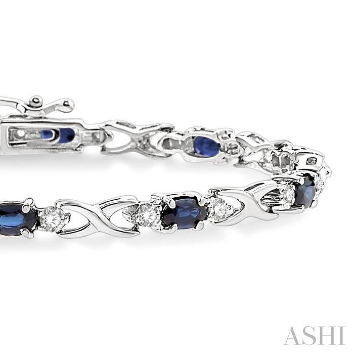 5x3 MM Oval Cut Sapphire and 1/10 Ctw Round Cut Diamond Bracelet in 10K White Gold