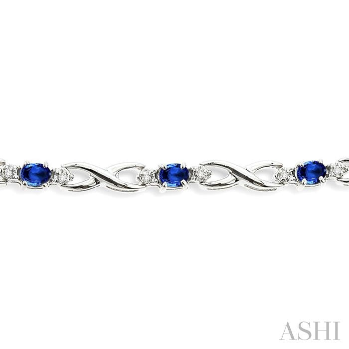 4x3 MM Oval Cut Sapphire and 1/10 ctw Single Cut Diamond Bracelet in 14K White Gold