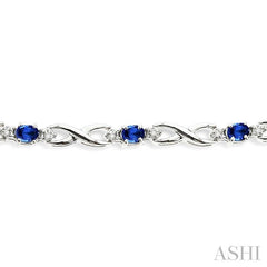 4x3 MM Oval Cut Sapphire and 1/10 ctw Single Cut Diamond Bracelet in 14K White Gold