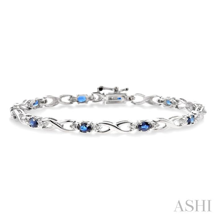 4x3 MM Oval Cut Sapphire and 1/10 Ctw Round Cut Diamond Bracelet in 14K White Gold