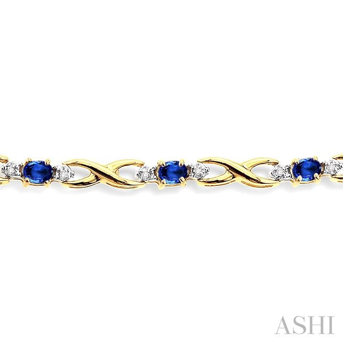 4x3 MM Oval Cut Sapphire and 1/10 Ctw Round Cut Diamond Bracelet in 14K Yellow Gold