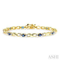 4x3 MM Oval Cut Sapphire and 1/10 Ctw Round Cut Diamond Bracelet in 14K Yellow Gold