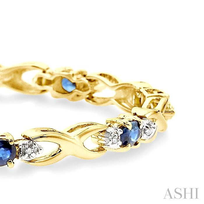 4x3 MM Oval Cut Sapphire and 1/10 Ctw Round Cut Diamond Bracelet in 14K Yellow Gold