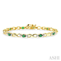 4x3 MM Oval Cut Emerald and 1/10 ctw Single Cut Diamond Bracelet in 10K Yellow Gold