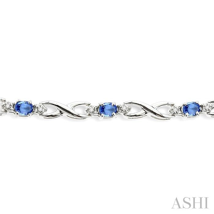 4x3mm Oval Cut Tanzanite and 1/10 ctw Single Cut Diamond Bracelet in 10K White Gold