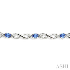 4x3mm Oval Cut Tanzanite and 1/10 ctw Single Cut Diamond Bracelet in 10K White Gold