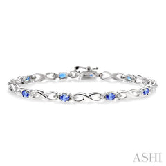 4x3mm Oval Cut Tanzanite and 1/10 ctw Single Cut Diamond Bracelet in 10K White Gold