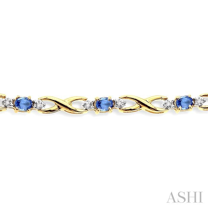 4x3mm Oval Cut Tanzanite and 1/10 Ctw Round Cut Diamond Bracelet in 10K Yellow Gold