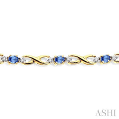 4x3mm Oval Cut Tanzanite and 1/10 Ctw Round Cut Diamond Bracelet in 10K Yellow Gold